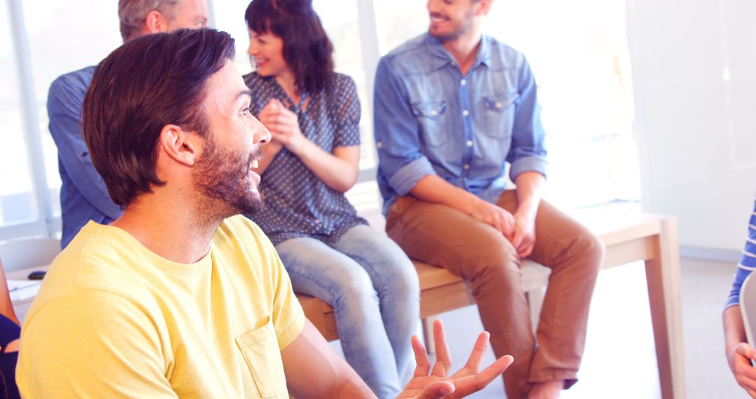 Group Engaging in Lively Workshop Discussion with Joy and Enthusiasm