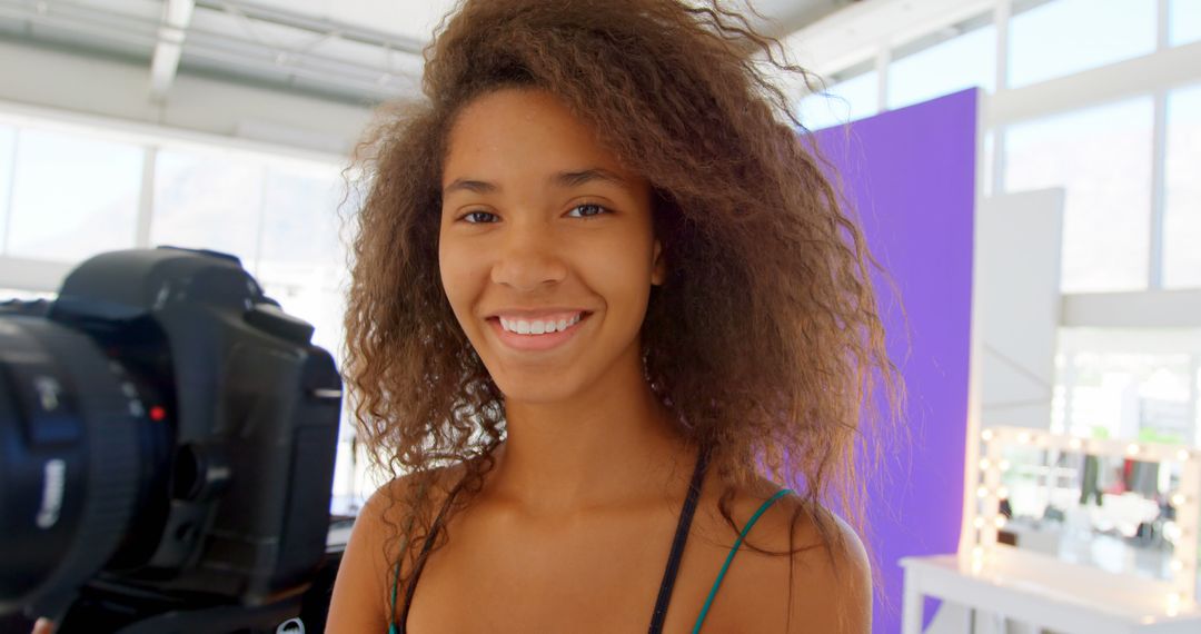 Young Woman Smiling in Photo Studio With Natural Light - Free Images, Stock Photos and Pictures on Pikwizard.com