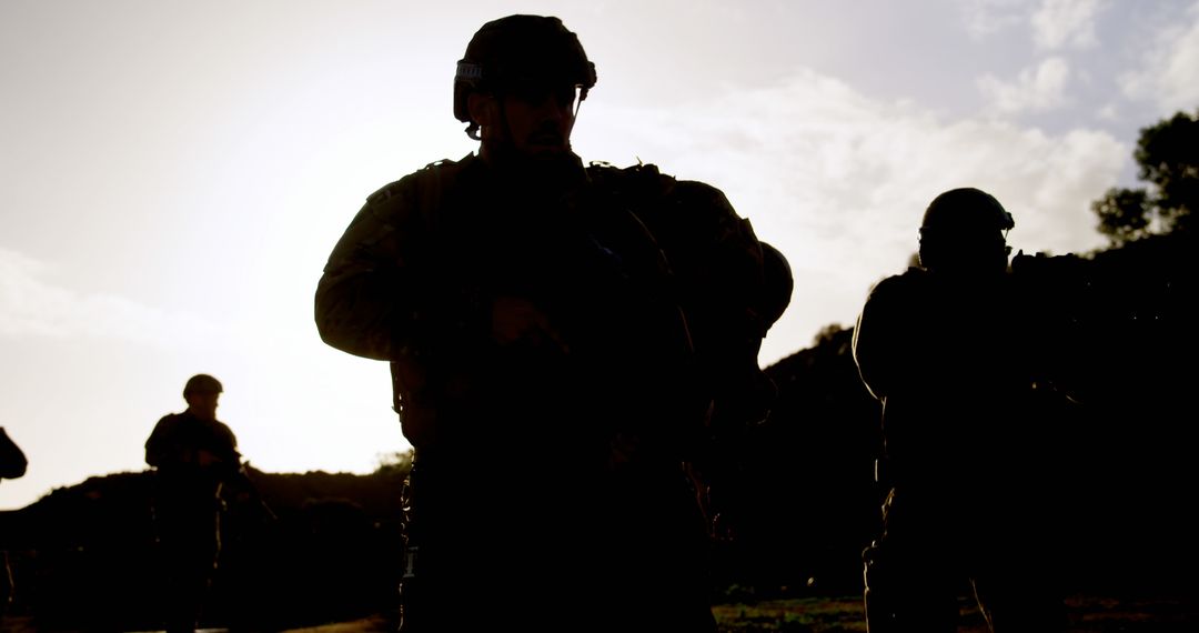 Silhouetted Soldiers in Military Combat Training