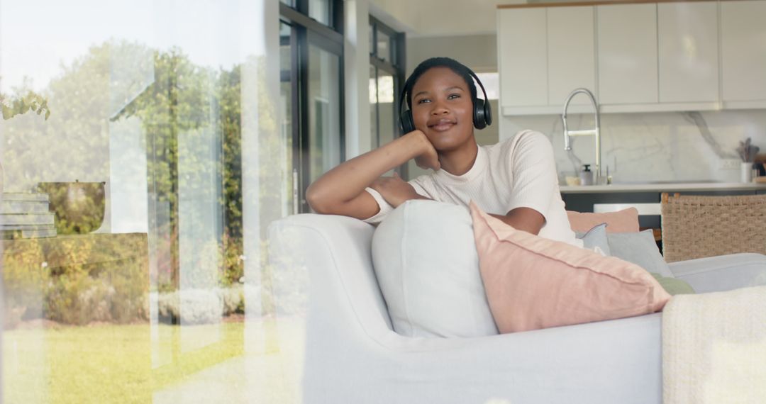 Woman Relaxing on Couch Listening to Music with Headphones at Home - Free Images, Stock Photos and Pictures on Pikwizard.com