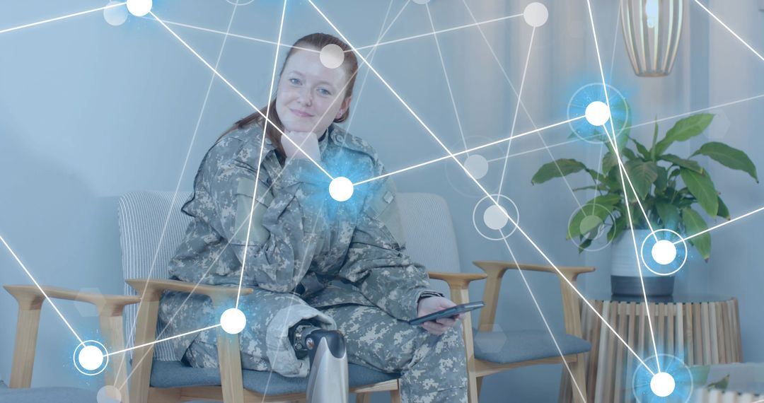 Soldier with Prosthetic Leg Using Technology in Lounge Space