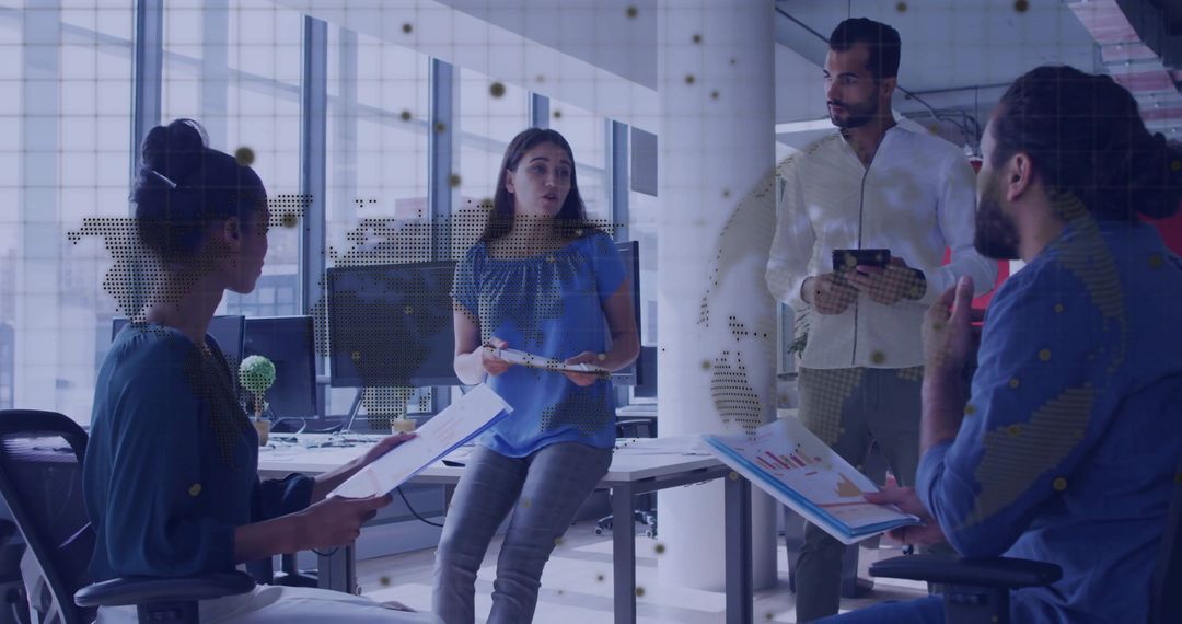 Multicultural Team Collaborating with Charts in Modern Office