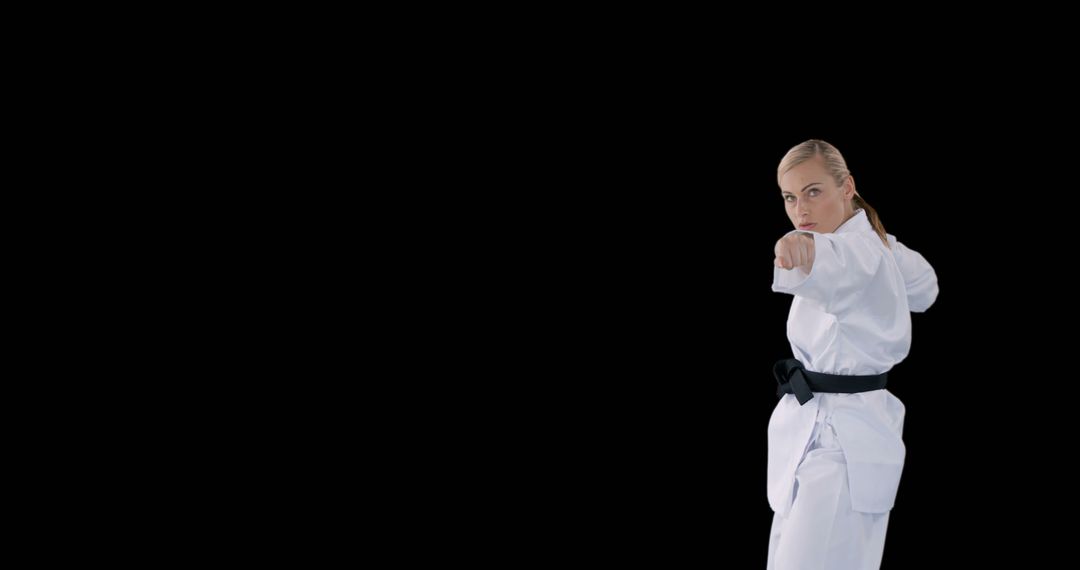 Female Martial Artist Practicing Punches in Karate Gi - Free Images, Stock Photos and Pictures on Pikwizard.com