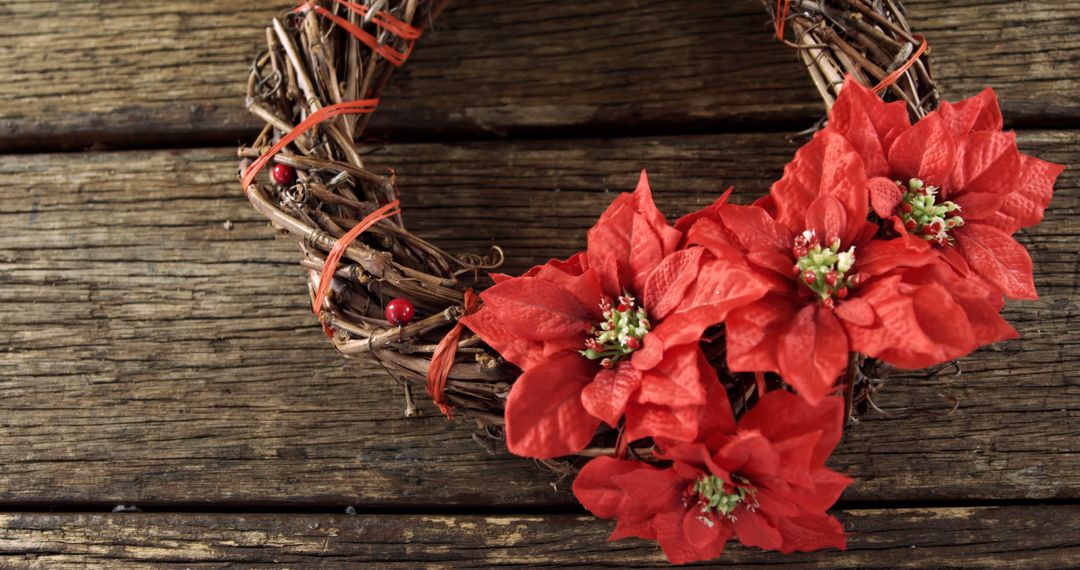 Festive Poinsettia Wreath on Rustic Wood Background for Holiday Decor - Free Images, Stock Photos and Pictures on Pikwizard.com