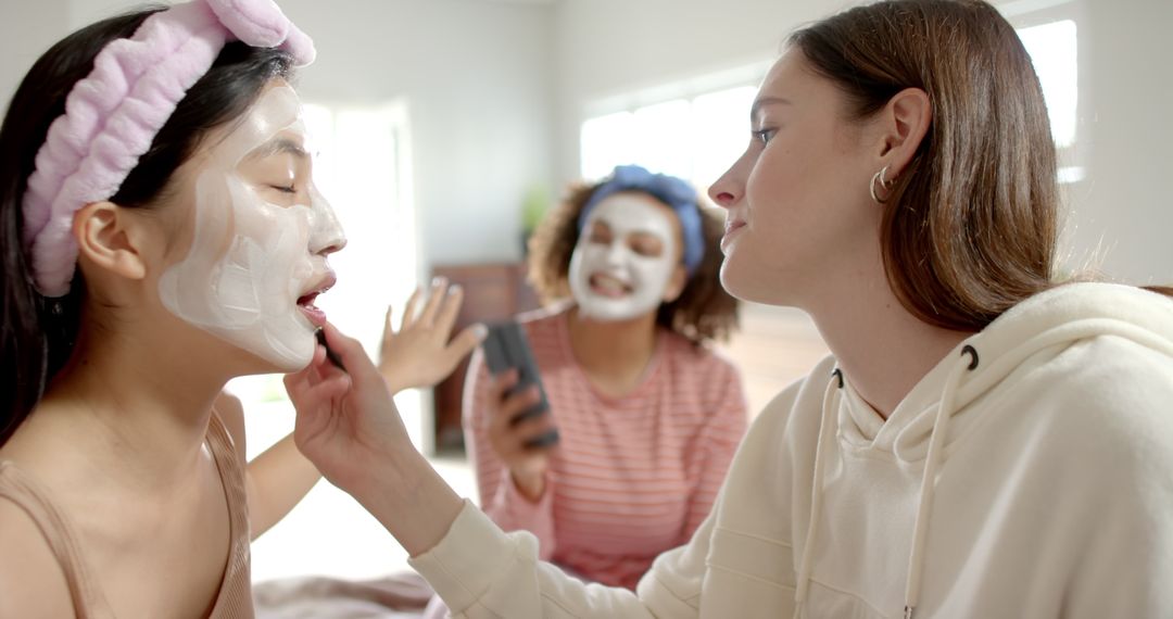 Diverse Friends Enjoying Skincare Routine Together at Home