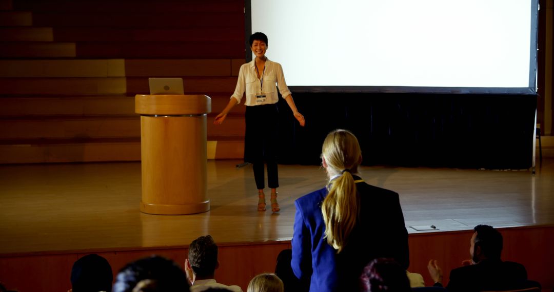 Young Businesswoman Delivering Inspiring Seminar Presentation - Free Images, Stock Photos and Pictures on Pikwizard.com