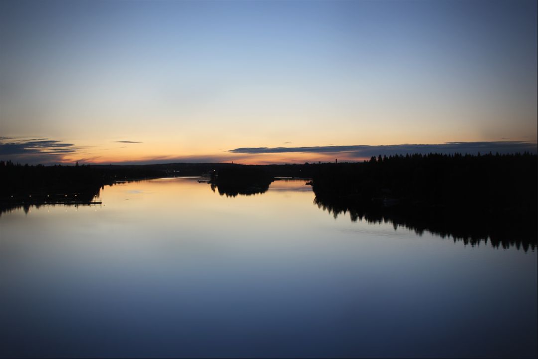Tranquil Sunset Over Calm Lake with Forest Reflections - Free Images, Stock Photos and Pictures on Pikwizard.com