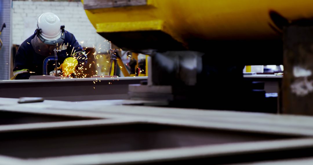 Industrial Worker Wearing Safety Gear Using Welding Torch - Free Images, Stock Photos and Pictures on Pikwizard.com