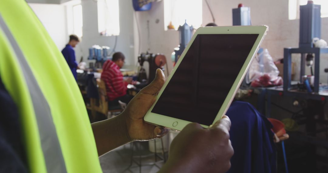 Close-Up of Engineer Using Tablet in Industrial Workspace - Free Images, Stock Photos and Pictures on Pikwizard.com