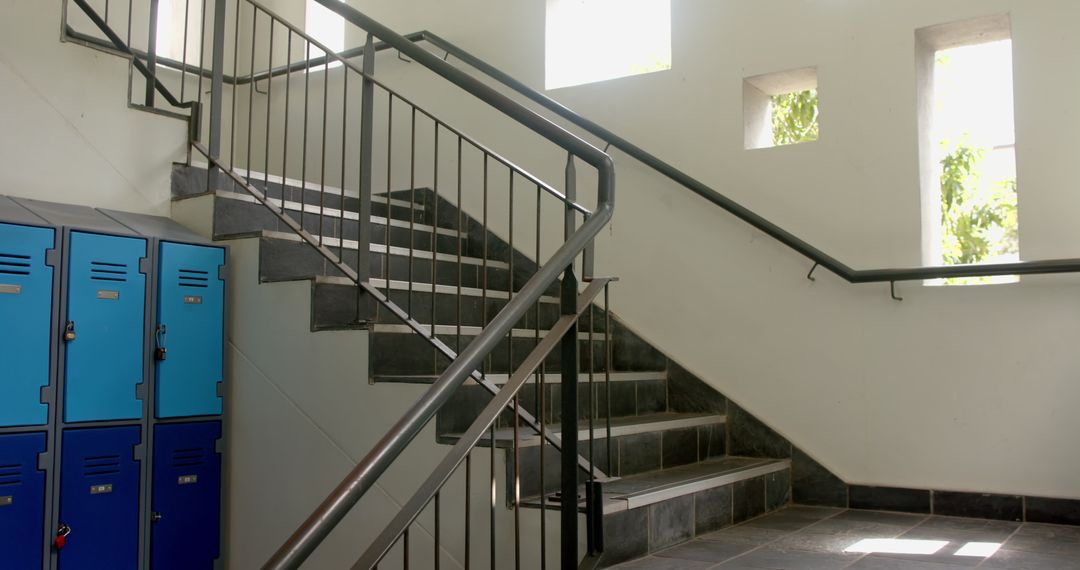 Sunlit School Corridor Staircase with Lockers