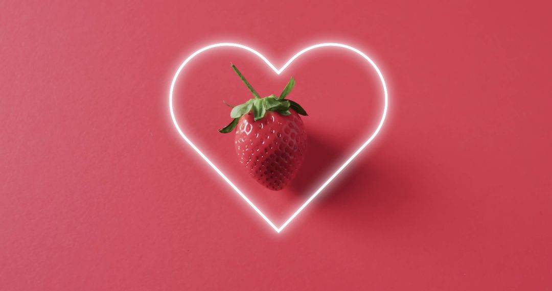 Neon Heart Framing Strawberry on Pink Background