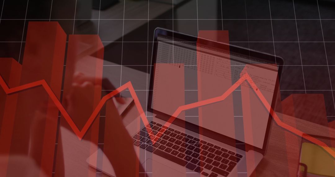 Modern Workspace with Laptop and Financial Graph Overlay