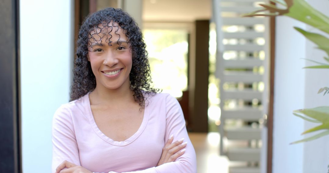 Smiling African American Woman in Modern Home Entranceway