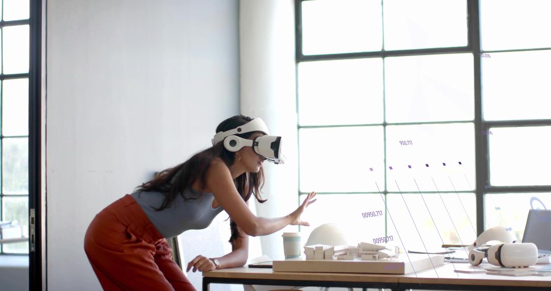 Designer Using VR Headset for Futuristic AR Interface Interaction