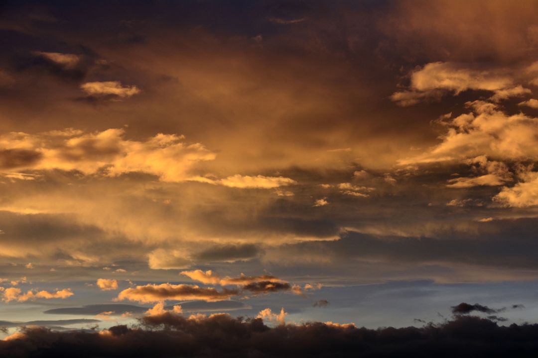 Golden Sunset Sky with Dramatic Clouds - Free Images, Stock Photos and Pictures on Pikwizard.com
