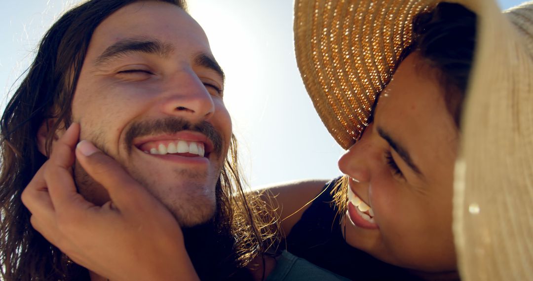 Young Couple Smiling and Embracing in Summer Sun - Free Images, Stock Photos and Pictures on Pikwizard.com