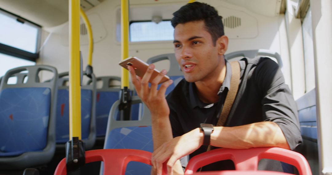 Young Man Speaking on Smartphone While Riding Public Bus - Free Images, Stock Photos and Pictures on Pikwizard.com