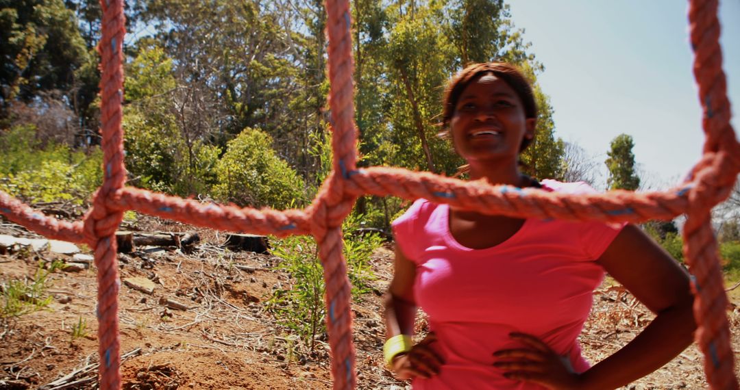 Woman Exercising on Outdoor Rope Climb in Forest - Free Images, Stock Photos and Pictures on Pikwizard.com