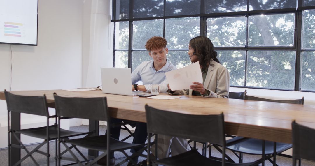 Diverse Business Professionals Discussing Project at Office