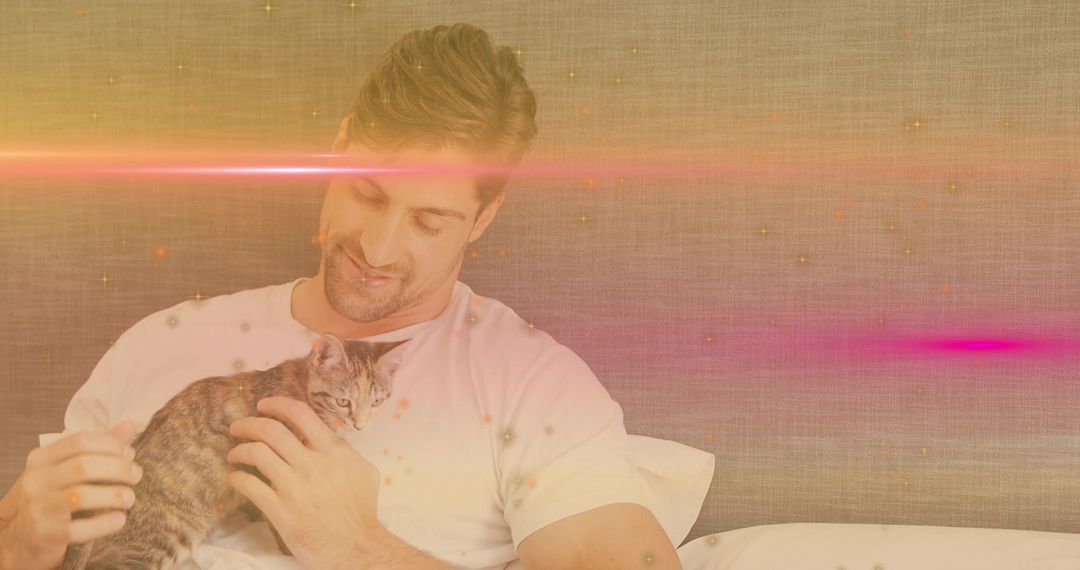 Man Relaxing with Kitten and Warm Sparkle Glow