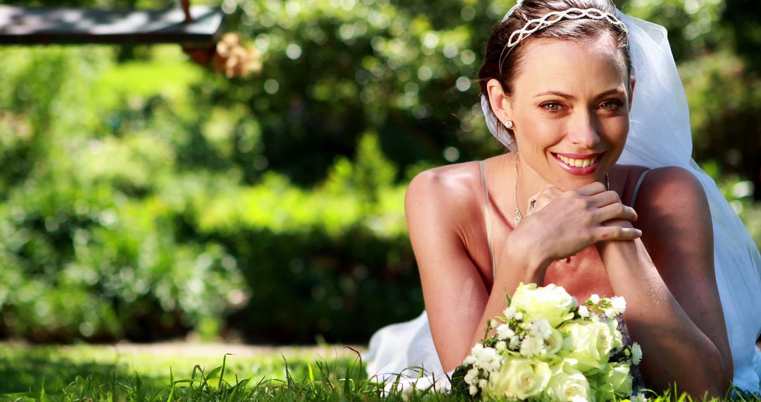 Beautiful Bride Posing on Grass Holding Bouquet Outdoors - Free Images, Stock Photos and Pictures on Pikwizard.com