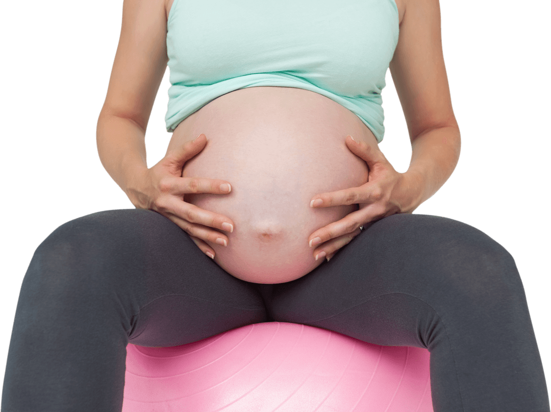 Pregnant Woman Sitting on Transparent Exercise Ball Embracing Bump