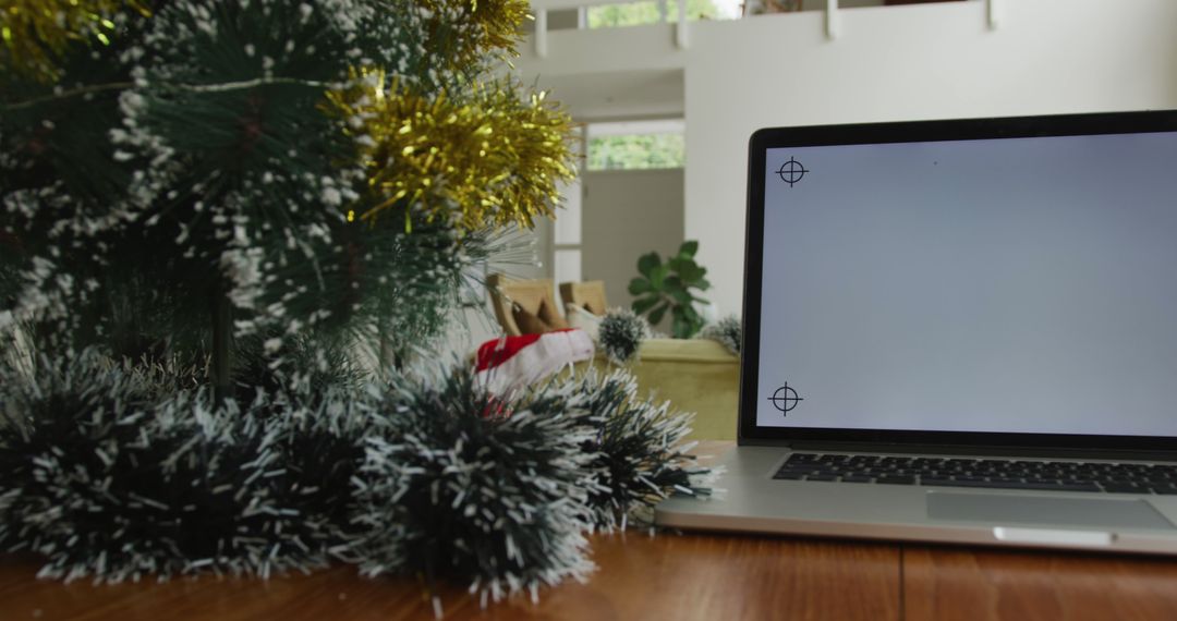 Christmas Decorations with Open Laptop on Wooden Table - Free Images, Stock Photos and Pictures on Pikwizard.com