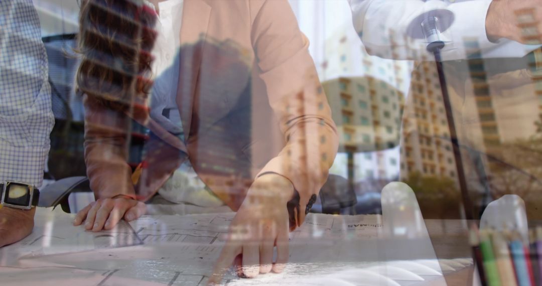 Architects Collaborating on Blueprints in Modern Urban Development Office