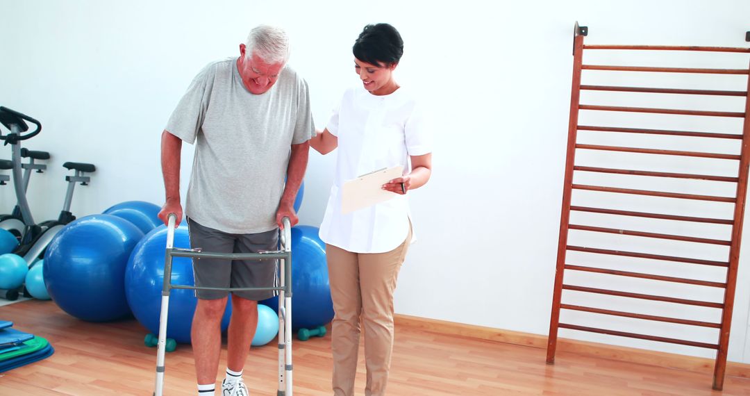 Elderly man receiving physical therapy with supportive therapist - Free Images, Stock Photos and Pictures on Pikwizard.com