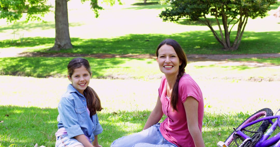 Smiling Mother and Daughter Enjoying Time Outdoors in Park - Free Images, Stock Photos and Pictures on Pikwizard.com