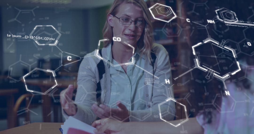 Female Students Discussing Chemistry in Modern Library