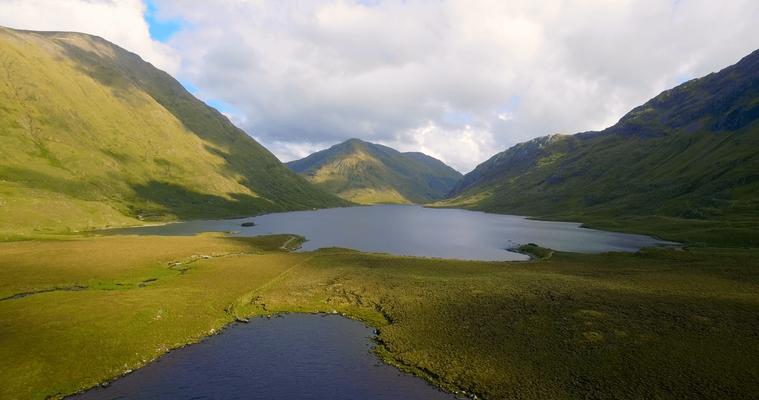 Transparent Tranquility: Serene Lake and Majestic Mountainscape