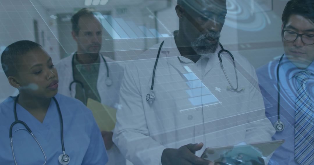 Diverse Medical Team Analyzing Data on Tablet in Hospital Corridor