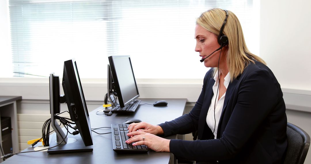 A middle-aged woman provides customer service remotely from her desk with a headset. - Free Images, Stock Photos and Pictures on Pikwizard.com