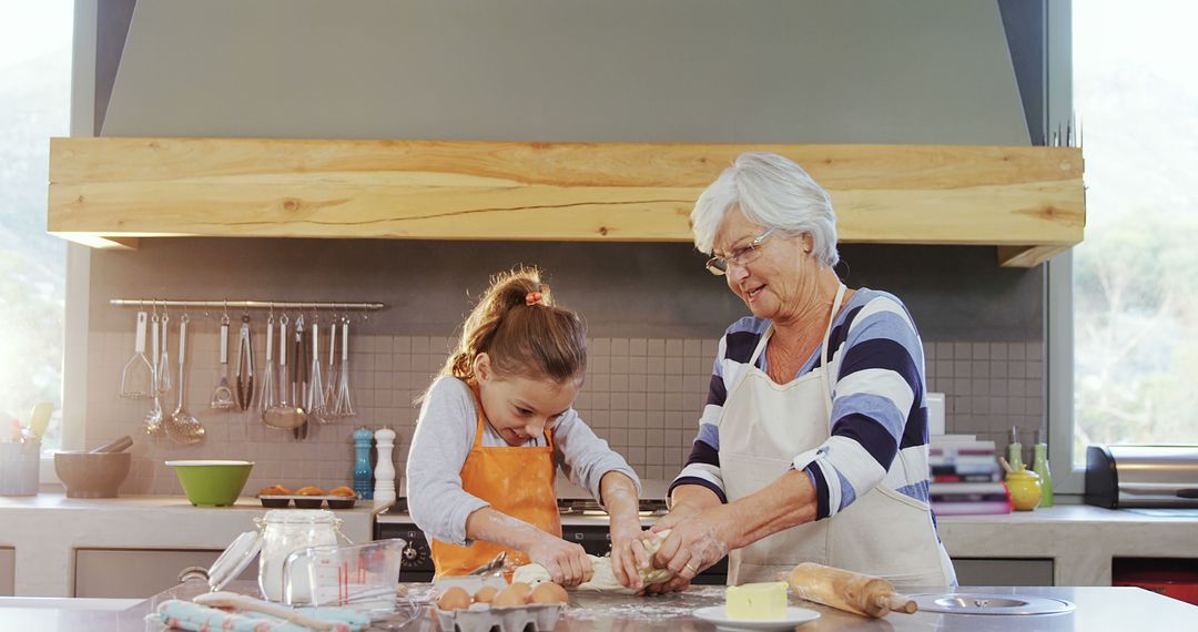 Grandmother and Granddaughter Baking Cookies Together in Modern Kitchen - Free Images, Stock Photos and Pictures on Pikwizard.com