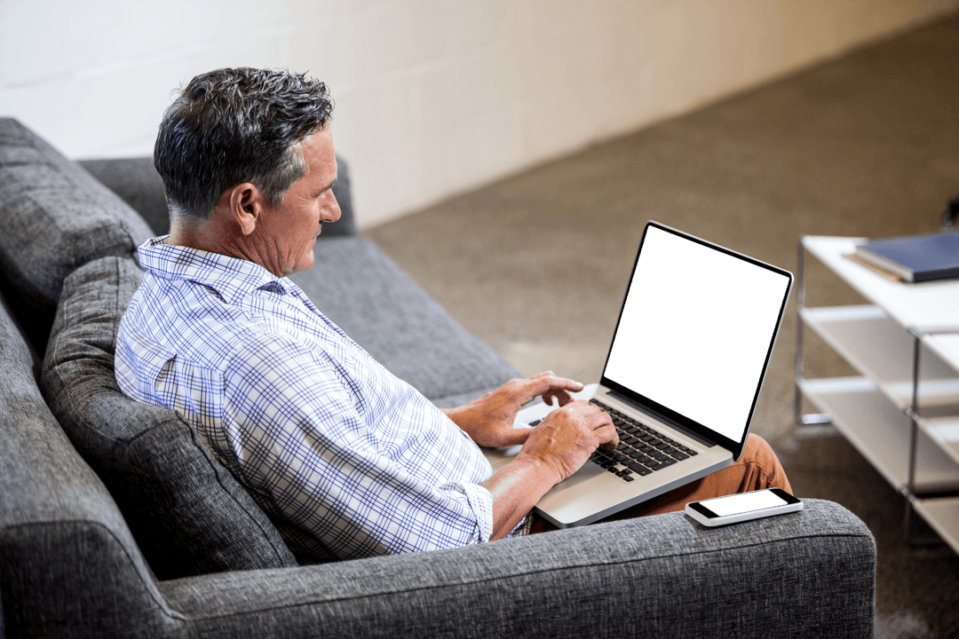 Businessman on Sofa Using Laptop with Blank Screen, Seamless Transparent Concept