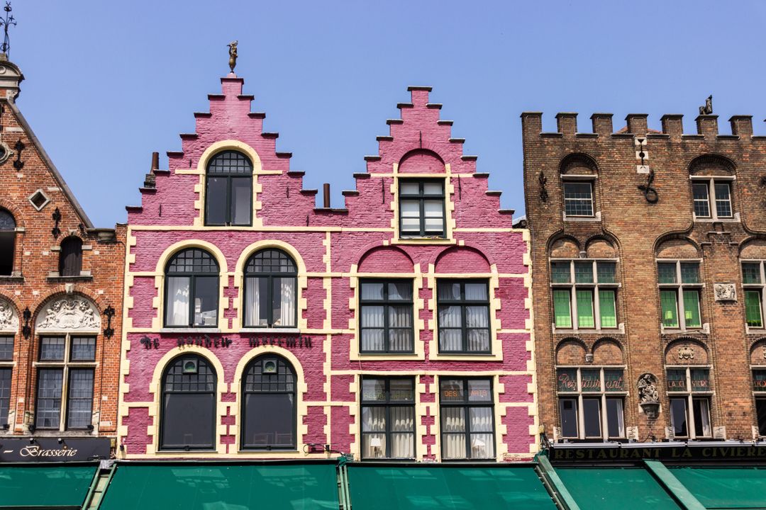 Colorful Traditional European Facades Under Clear Sky - Free Images, Stock Photos and Pictures on Pikwizard.com