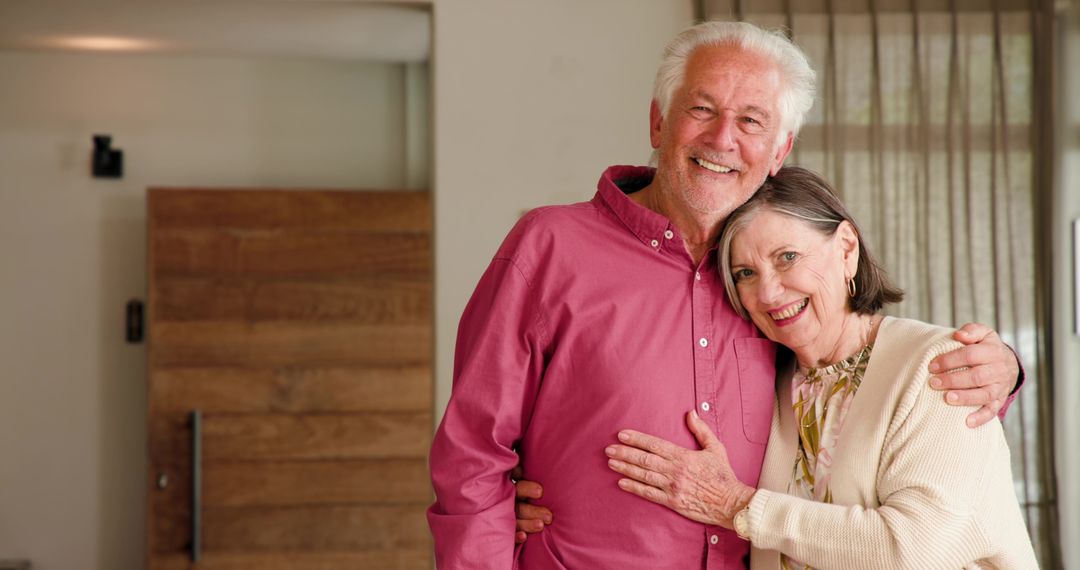 Senior Couple Hugging at Home Showing Warm Affection