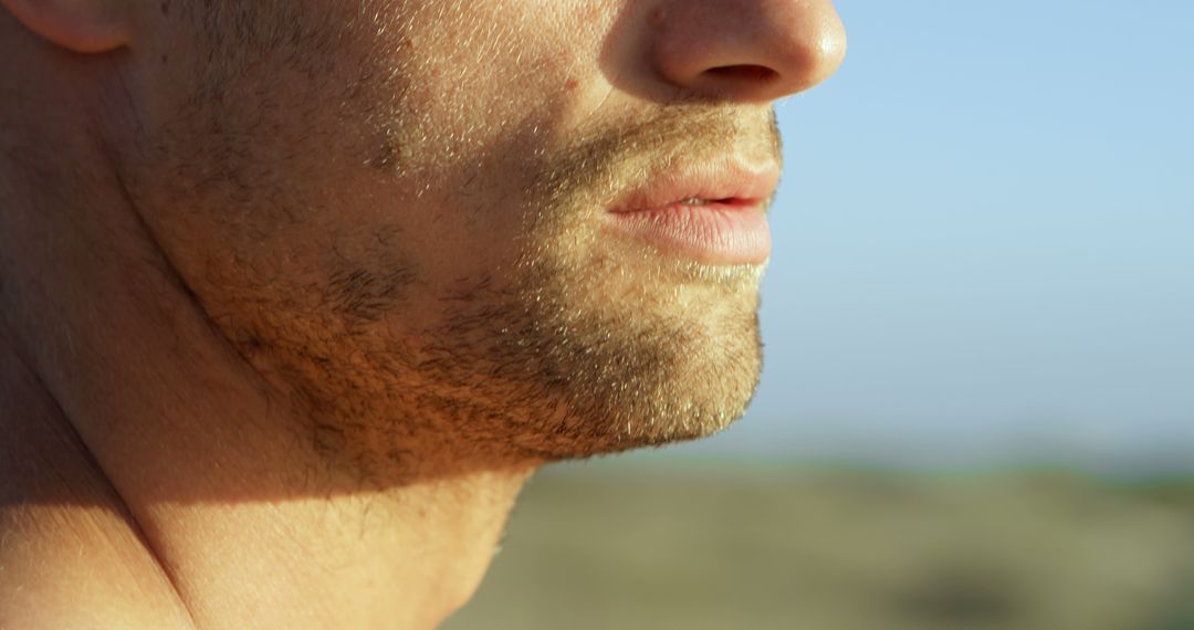 Close-Up of Man's Face with Beard in Natural Light Outdoors - Free Images, Stock Photos and Pictures on Pikwizard.com