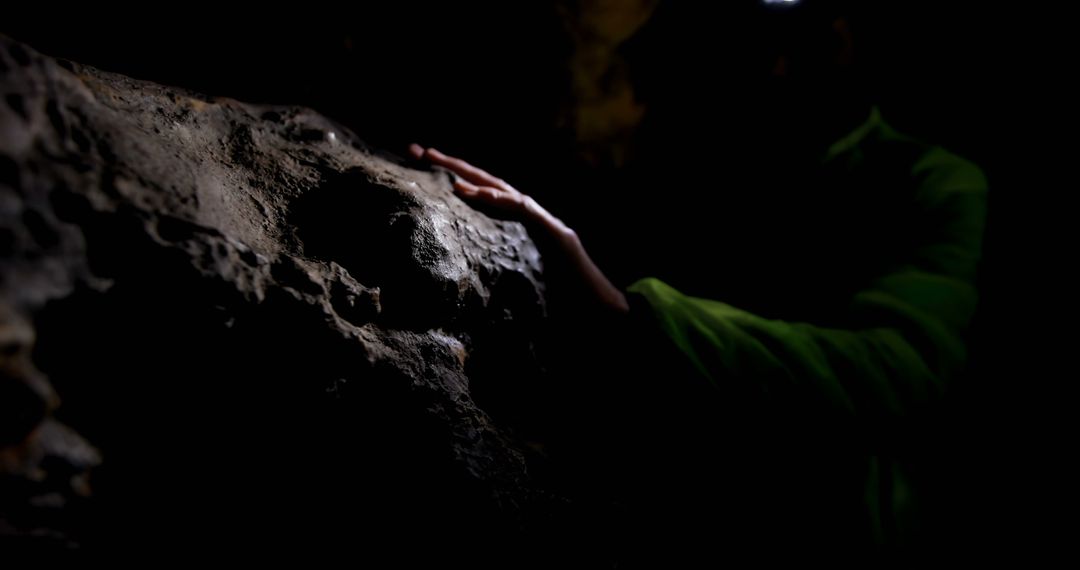 Hand Touching Surface in Dark Cave - Free Images, Stock Photos and Pictures on Pikwizard.com