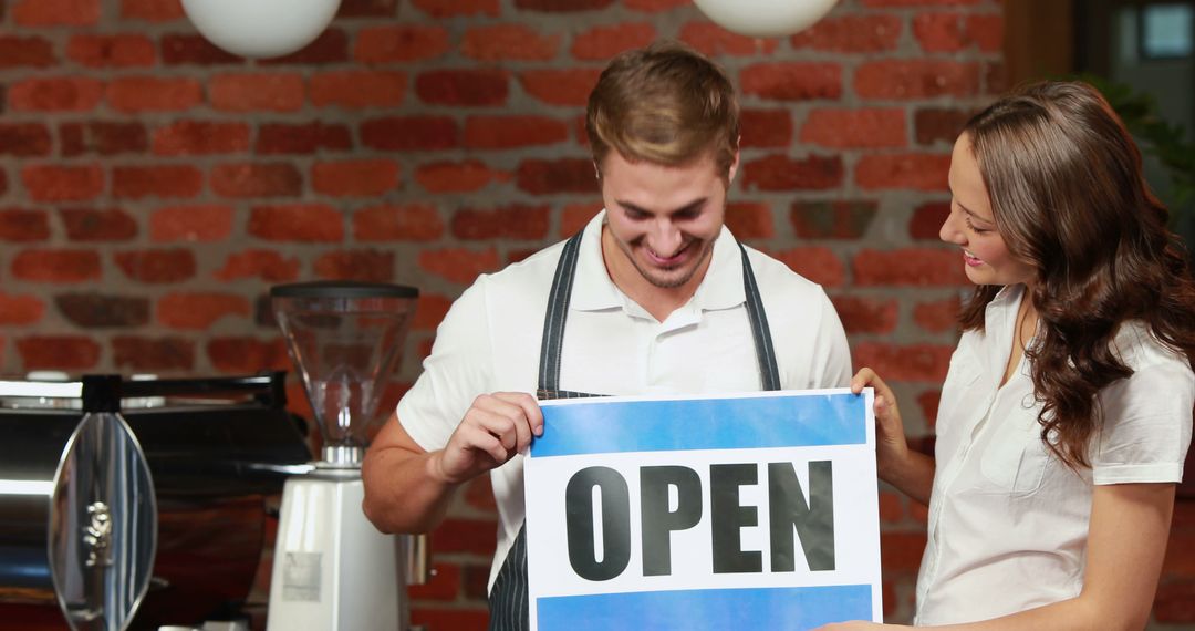 Cafe Owners Displaying Open Sign Preparing for Business - Free Images, Stock Photos and Pictures on Pikwizard.com