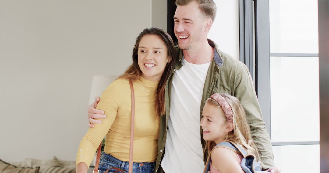 Happy Family Returning Home Embracing and Smiling