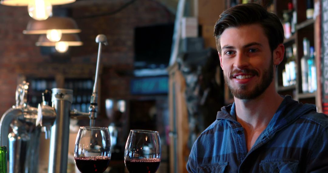 Smiling Bartender Serving Wine at Cozy Rustic Bar