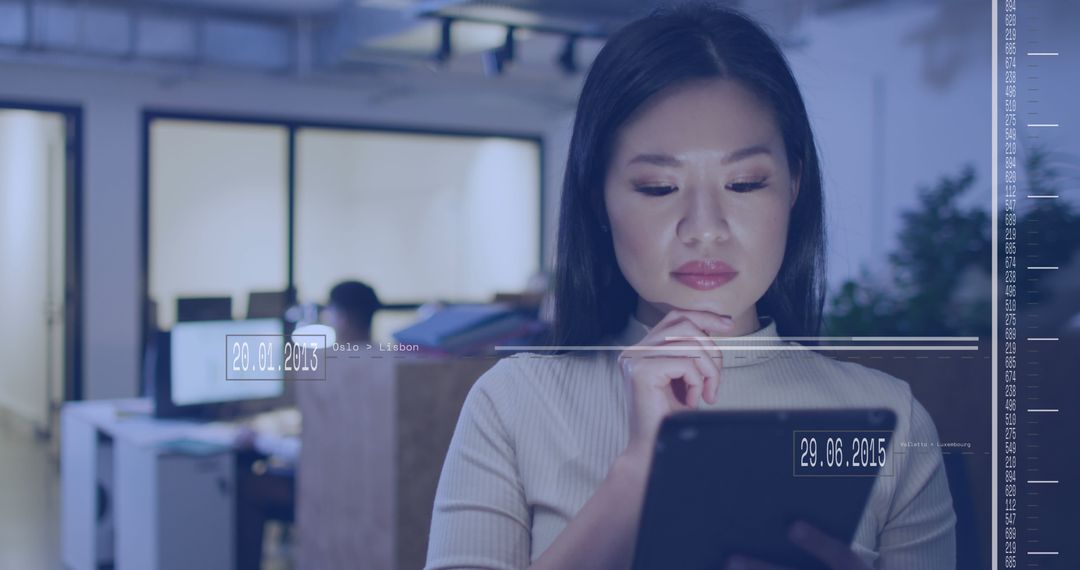 Businesswoman Using Tablet with Digital Data Overlay in Office