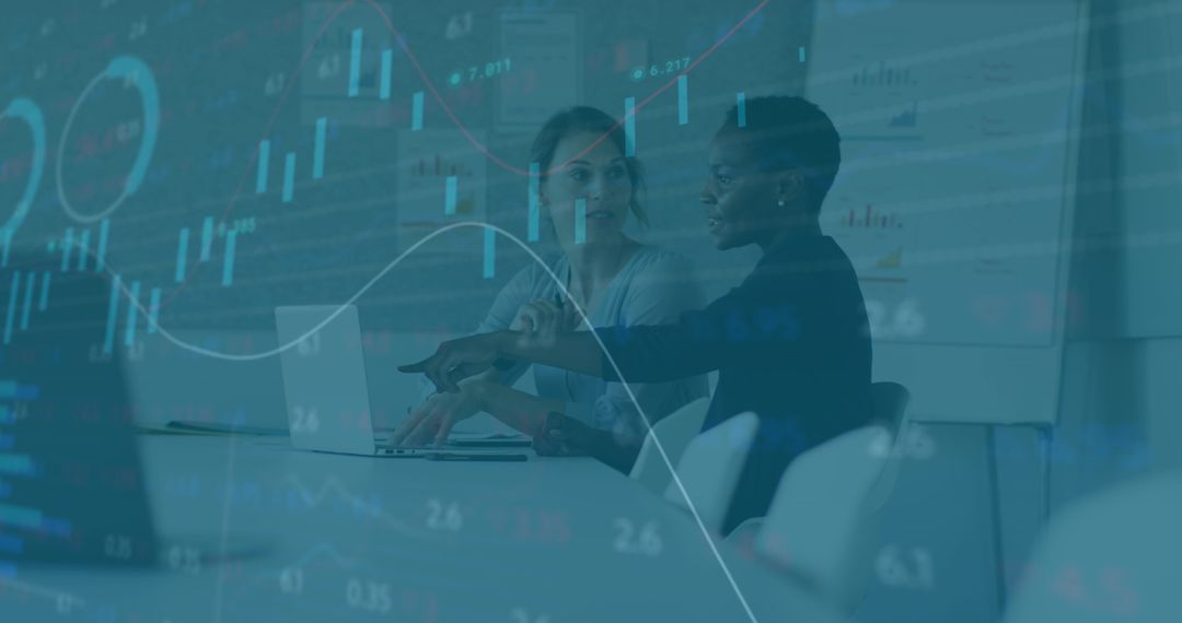 Diverse Coworkers Analyzing Financial Data Across Office Table