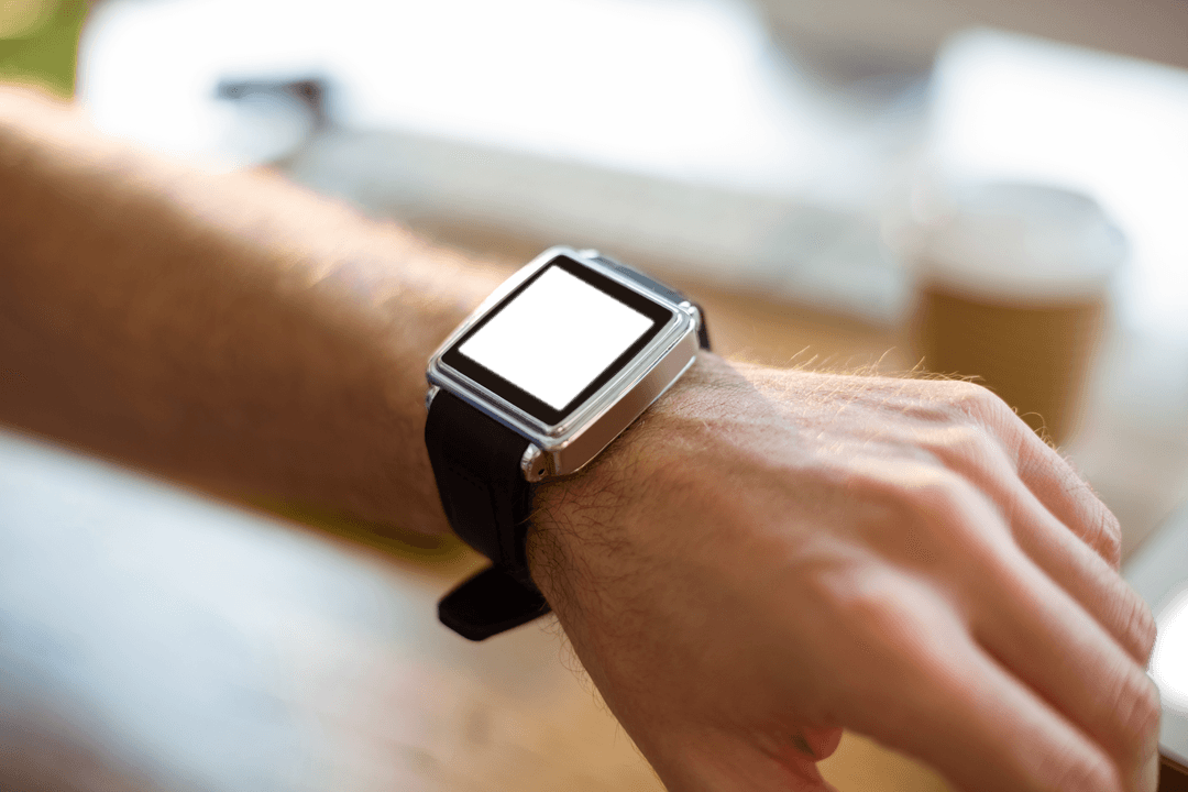 Modern Smartwatch on Male Wrist in Indoor Office Setting Transparent Display