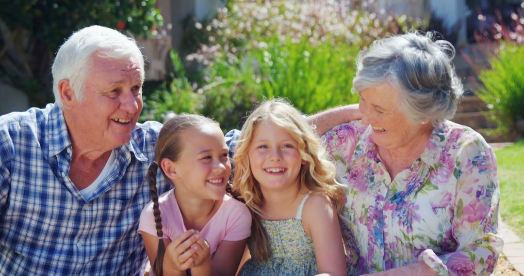 Happy Grandparents with Grandchildren outdoors on a Sunny Day - Free Images, Stock Photos and Pictures on Pikwizard.com