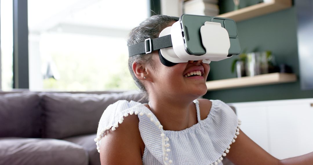 Smiling Girl Engaging with Virtual Reality at Home