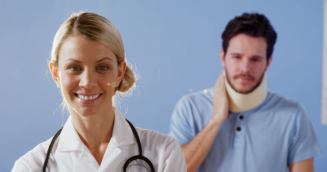 Smiling Doctor with Recovery Patient Wearing Neck Brace Indoors - Free Images, Stock Photos and Pictures on Pikwizard.com