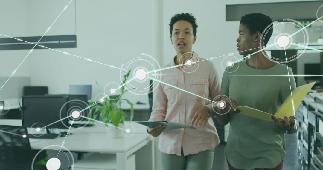 Diverse Coworkers Collaborate with Digital Connections in Office